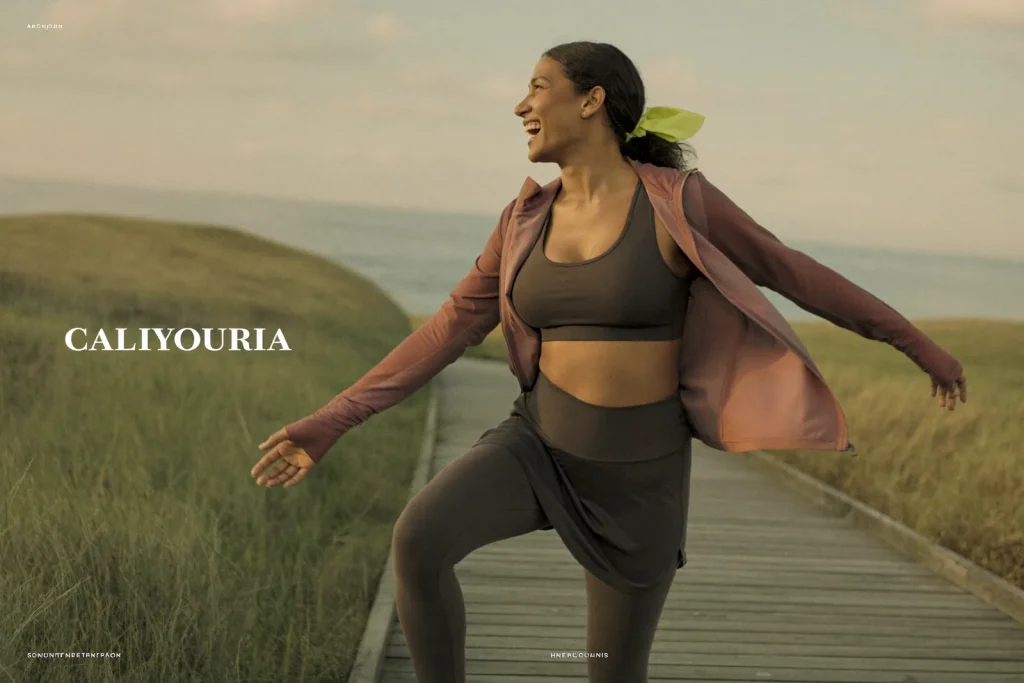 Woman enjoying a comfortable morning jog along the coast after breast reduction surgery near Newport Beach.